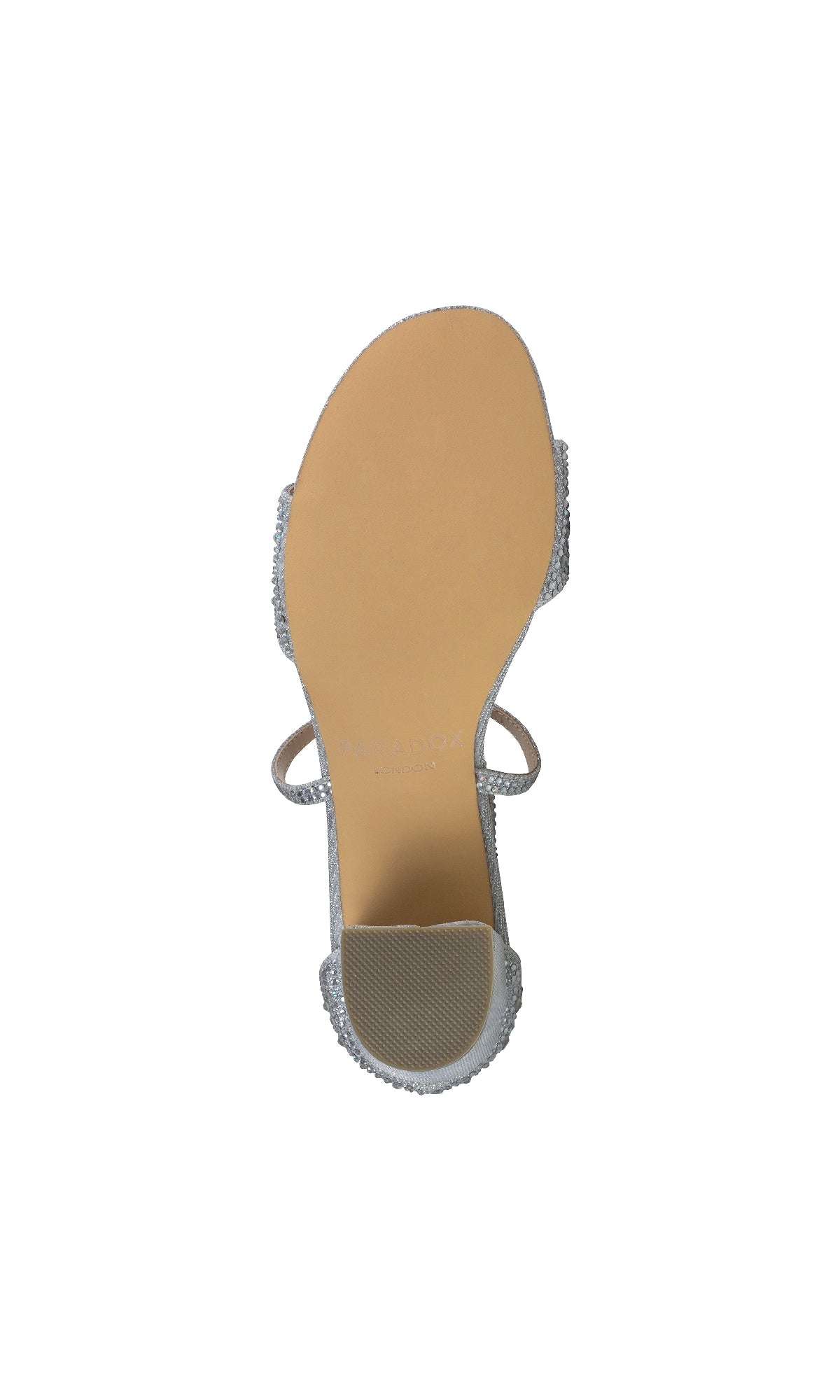 A top-down view of the sole of the Paradox London P2211 Ines Silver Prom Shoes, featuring a textured block heel, beige sole, and thin silver ankle strap, displayed on a white background.